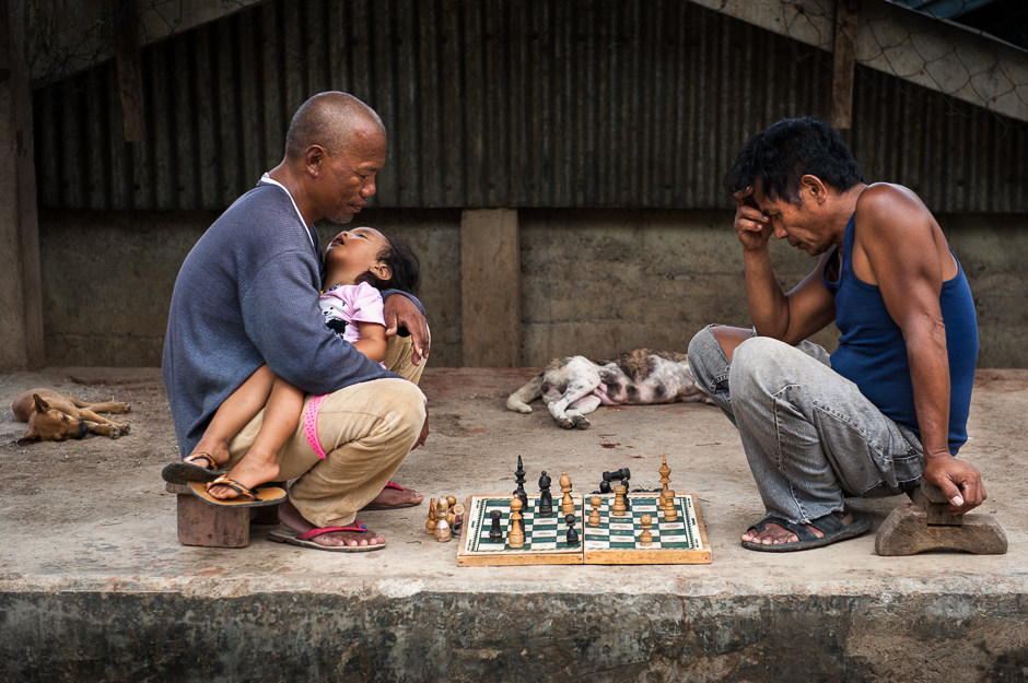 Men playing Chess