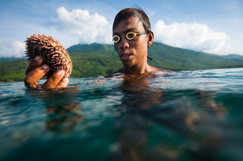 Badjao fisherman with sea urchin